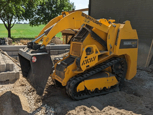 BaumaLight TRL620Y stand on compact mini loader