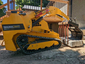 BaumaLight TRL620Y stand on compact mini loader